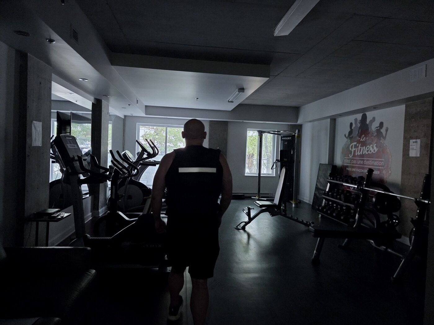 David arriving at the gym in low light